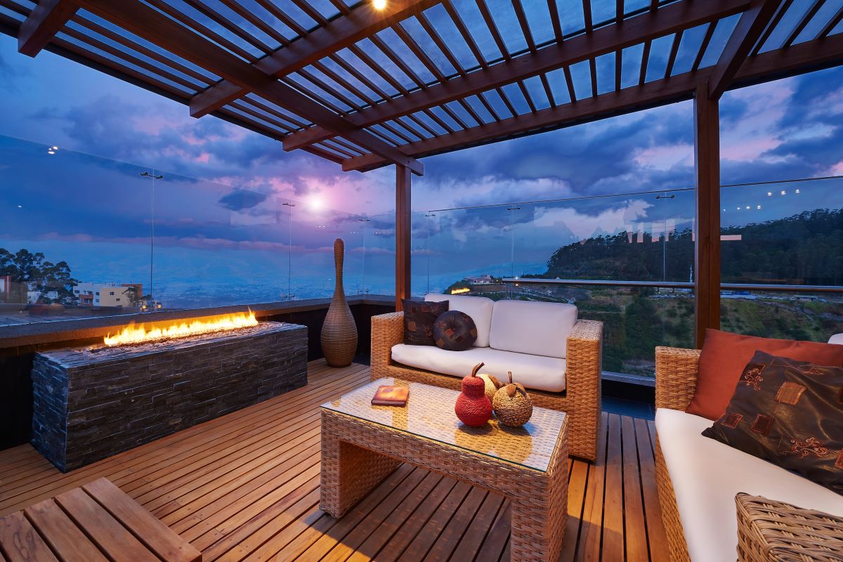 wooden deck with furniture on it.