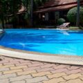 concrete pool with curved edge