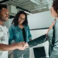 A patent attorney shakes hands with a client.