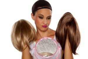 person choosing a wig