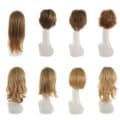 selection of wigs on mannequins