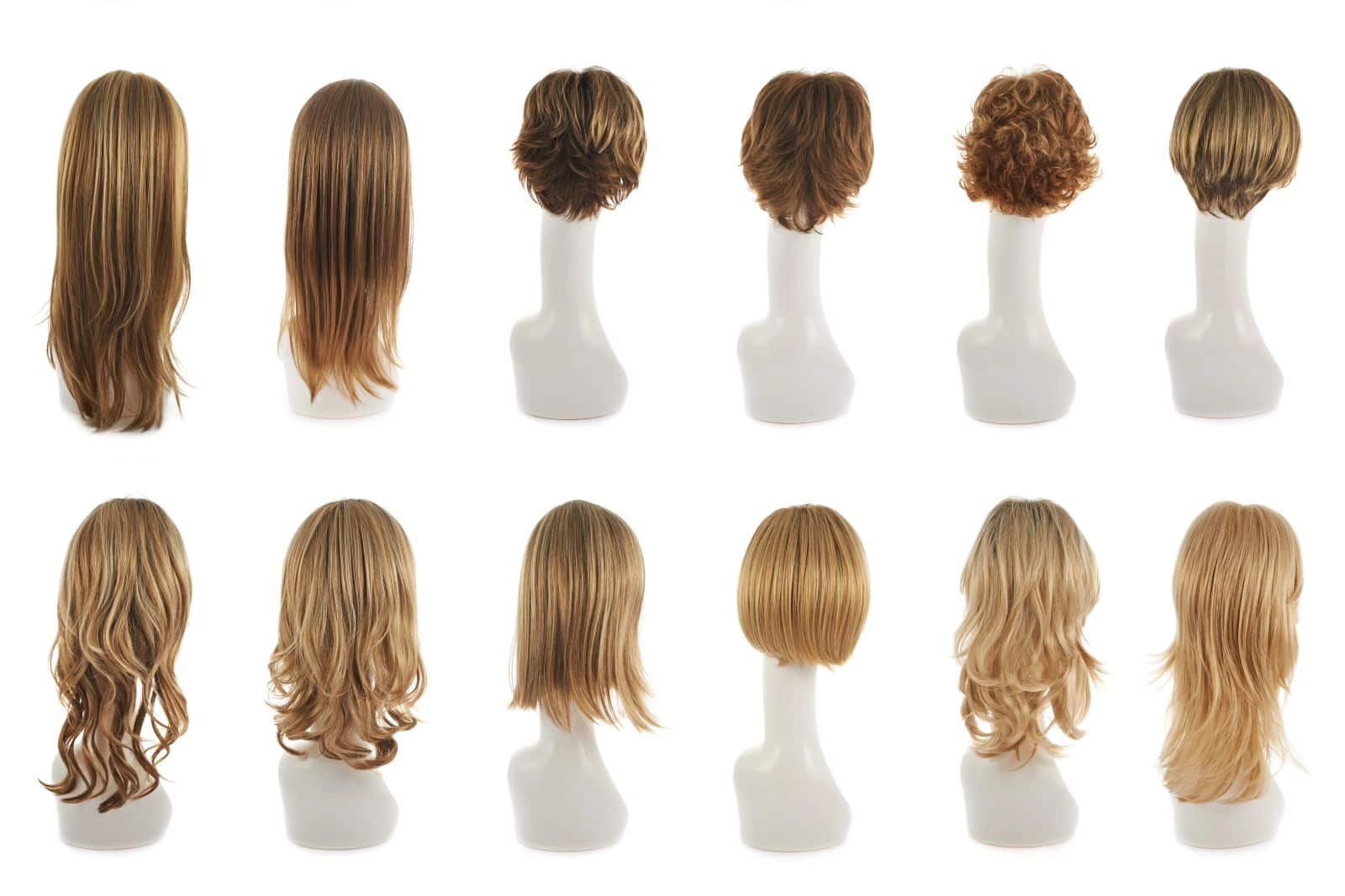 selection of wigs on mannequins